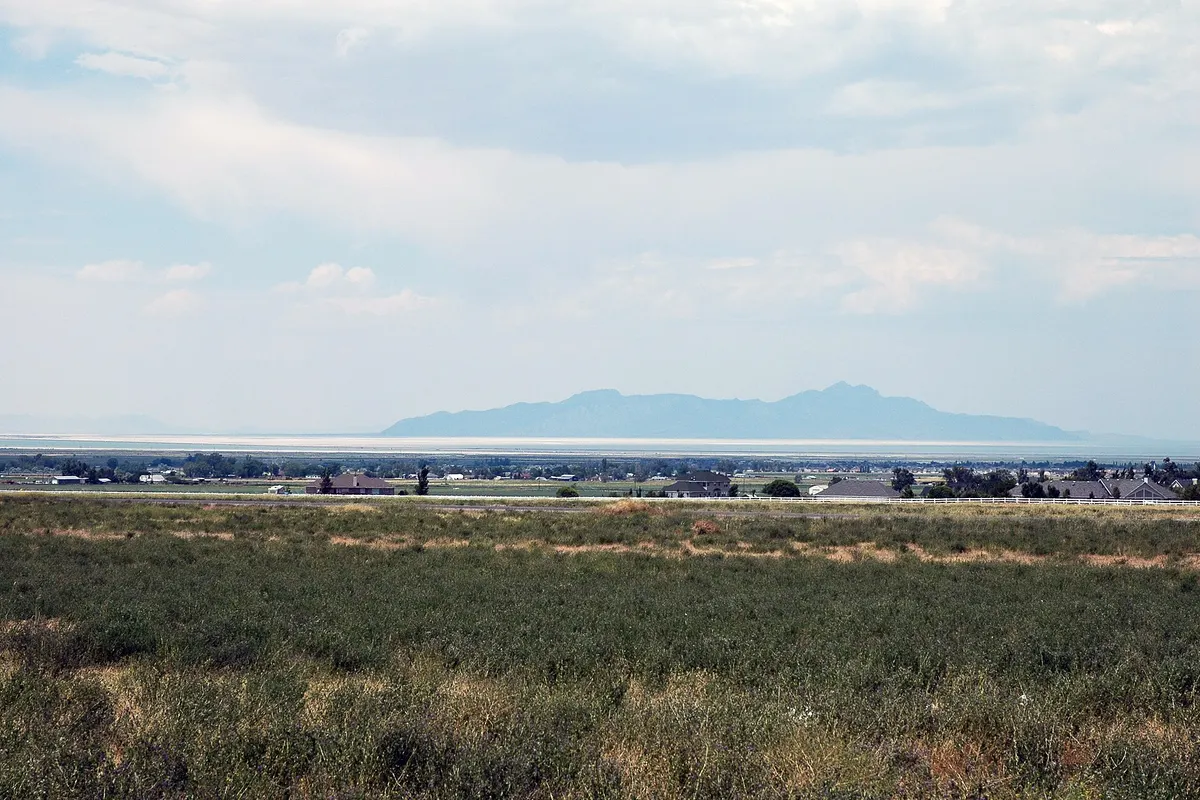 Open fields in Erda, Utah, looking north toward the Great Salt Lake with mountains on the horizon