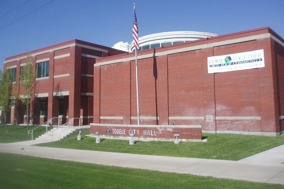 Tooele City Hall, a brick civic building with a clock tower, on Main Street in Tooele, Utah